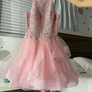 I’m selling this beautiful pretty short dress that has a light pink color.
